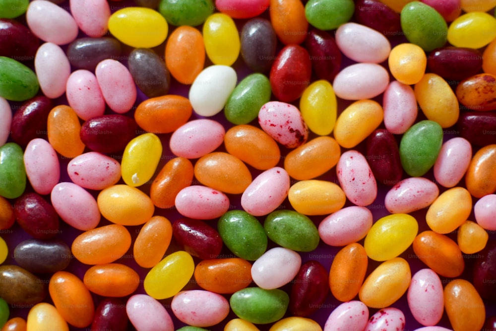 a close up of a pile of candy beans