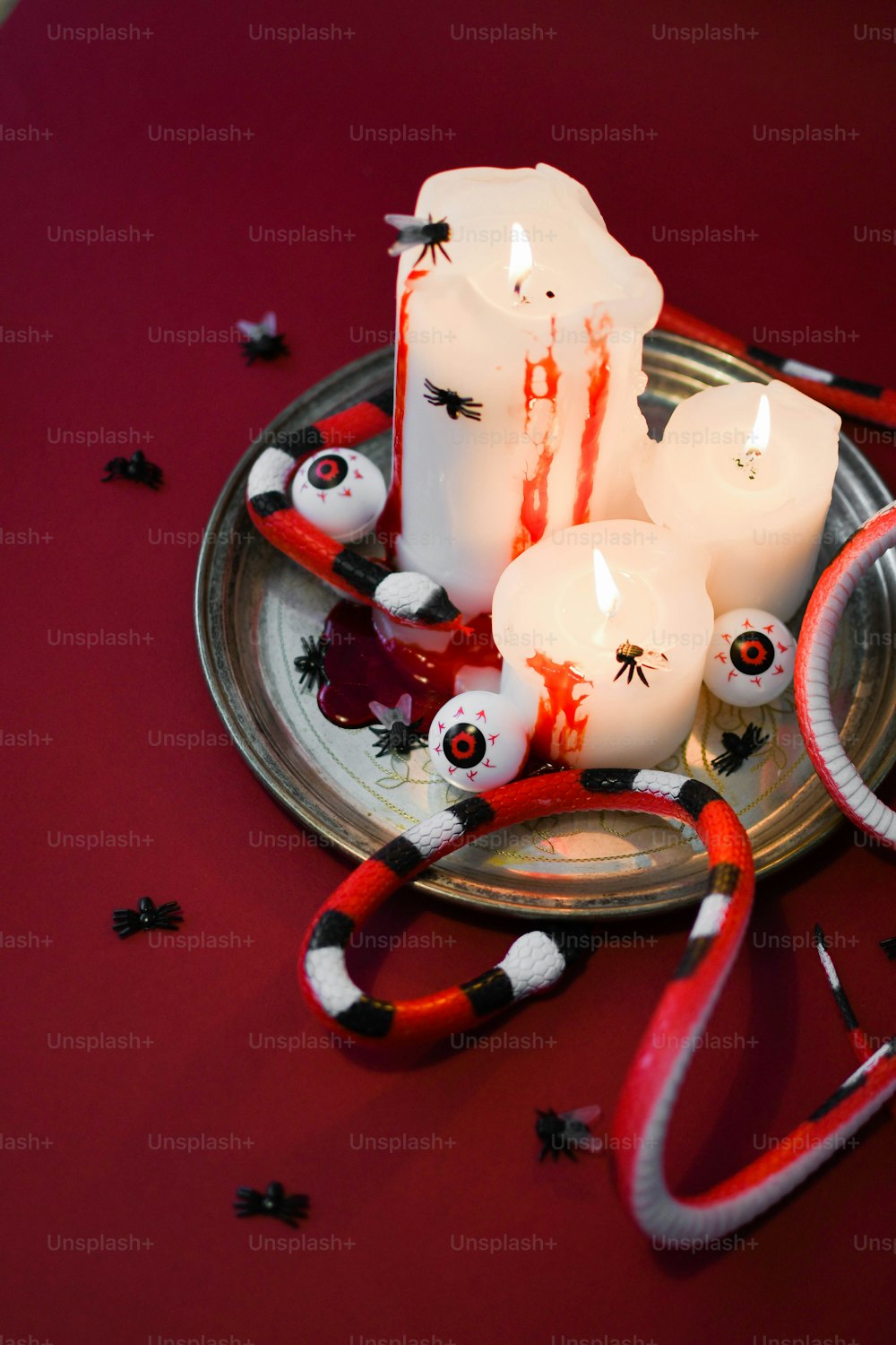 a group of candles sitting on top of a metal plate