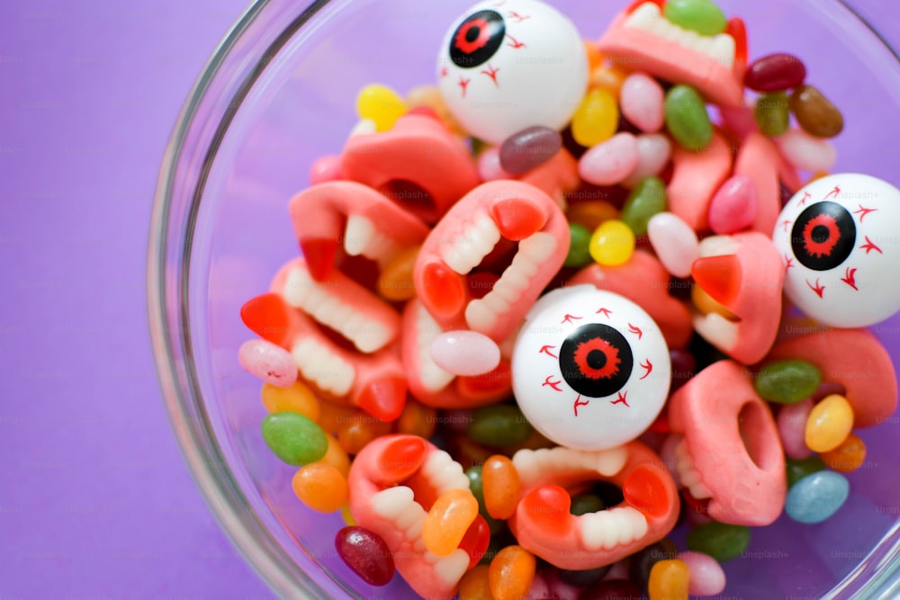 a bowl filled with lots of candy and eyeballs