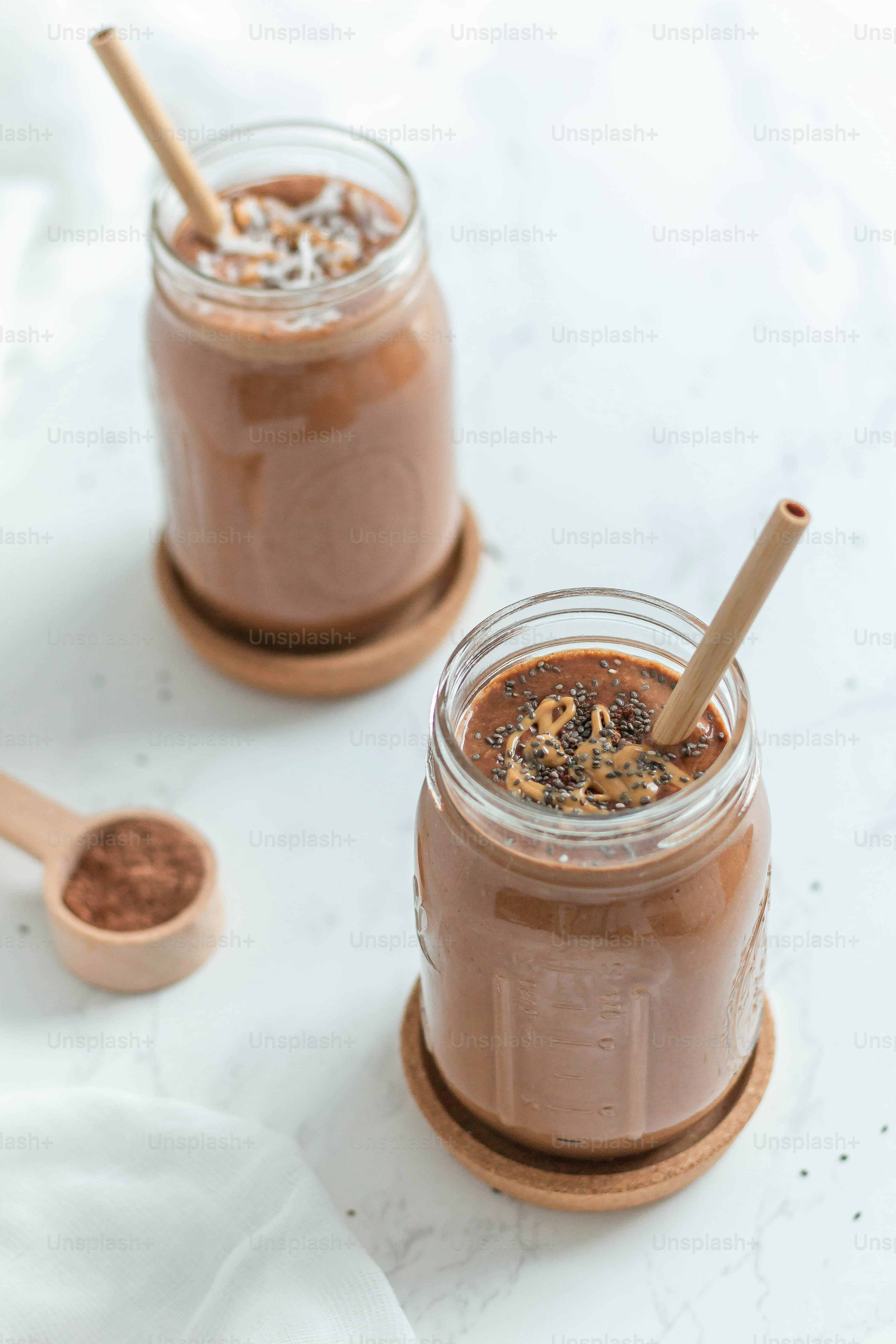 a couple of jars filled with food on top of a table