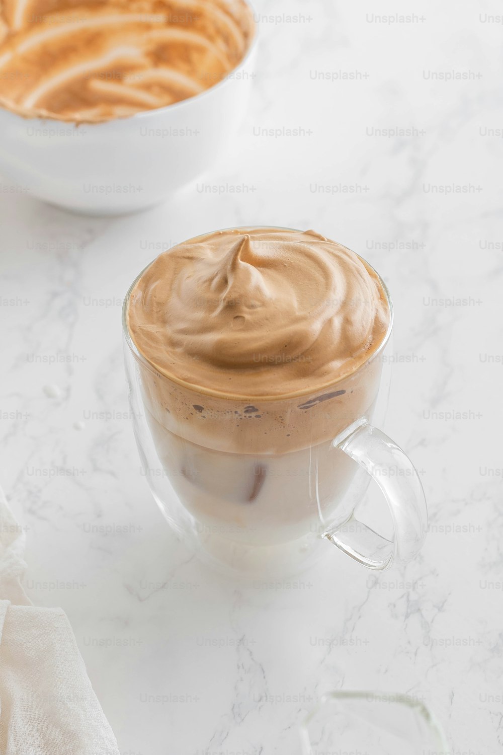 a couple of cups of coffee sitting on top of a table