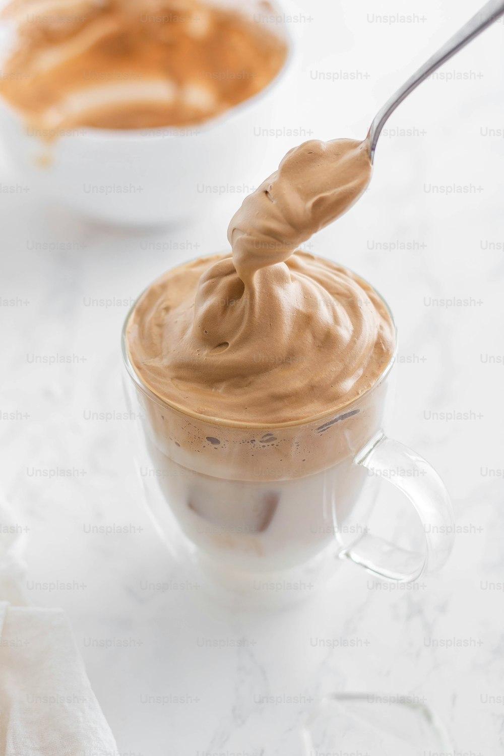a spoon is in a cup of chocolate pudding