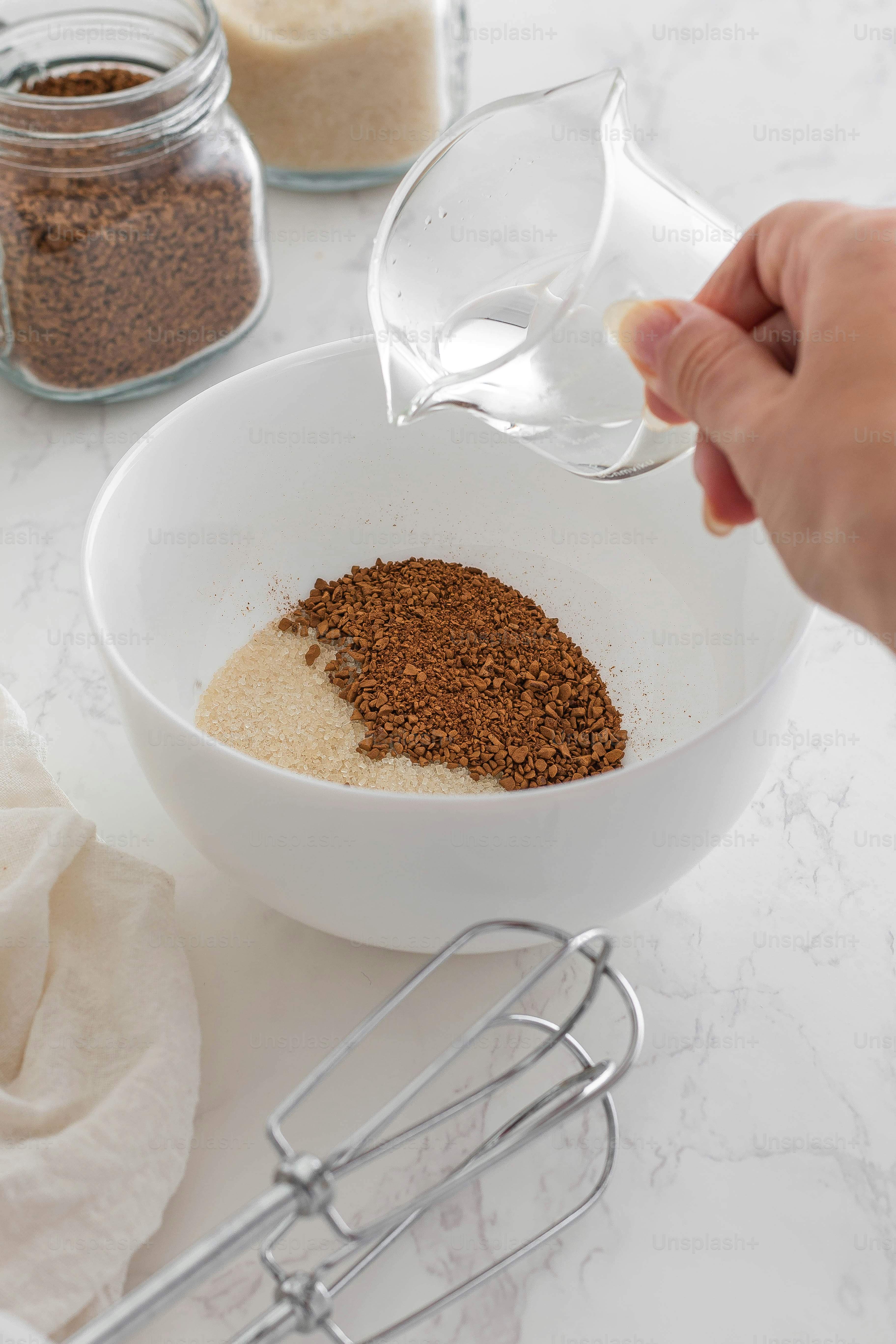 A person pouring a mixture into a bowl photo – Food Image on Unsplash