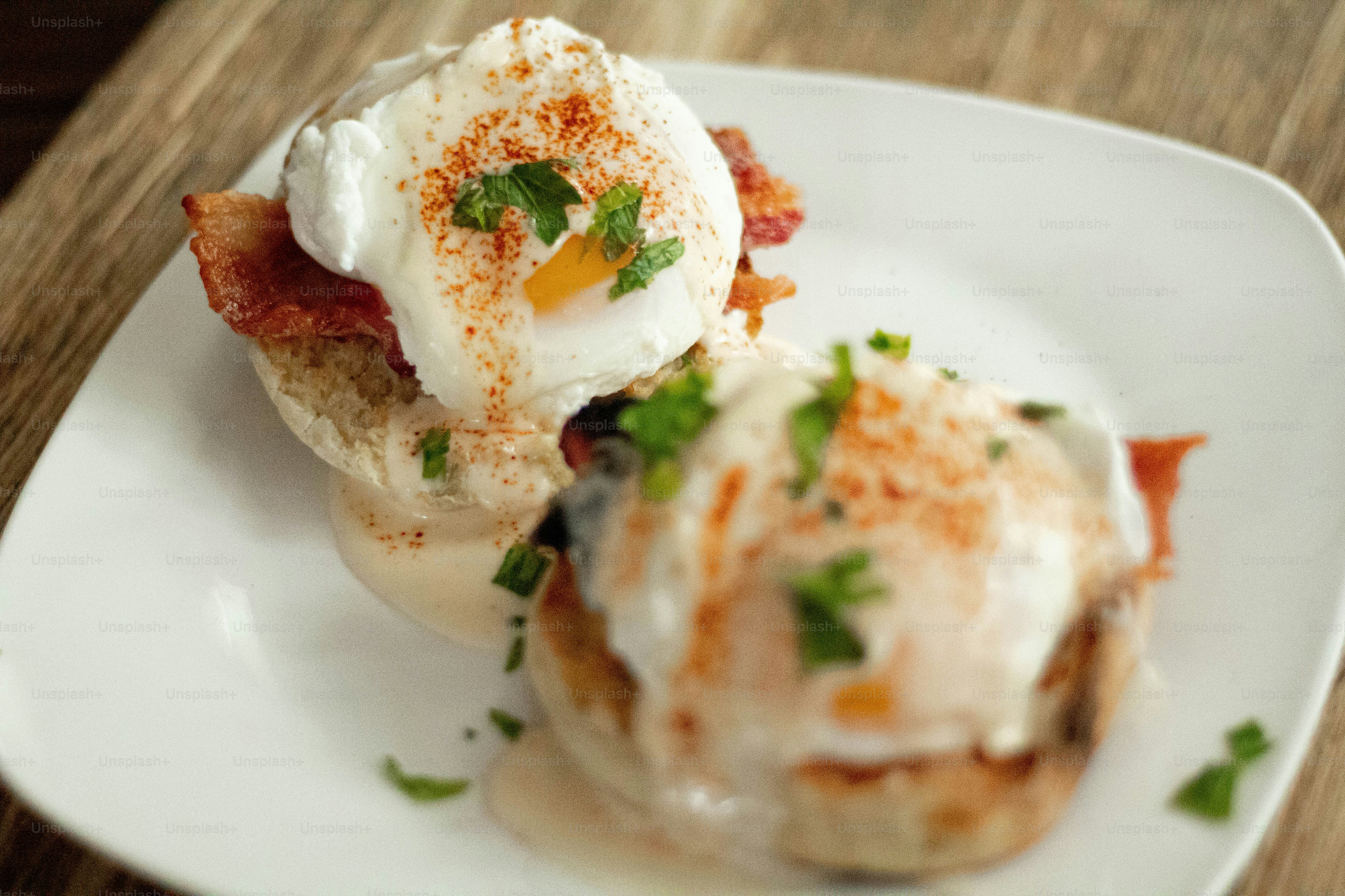 a white plate topped with eggs and bacon