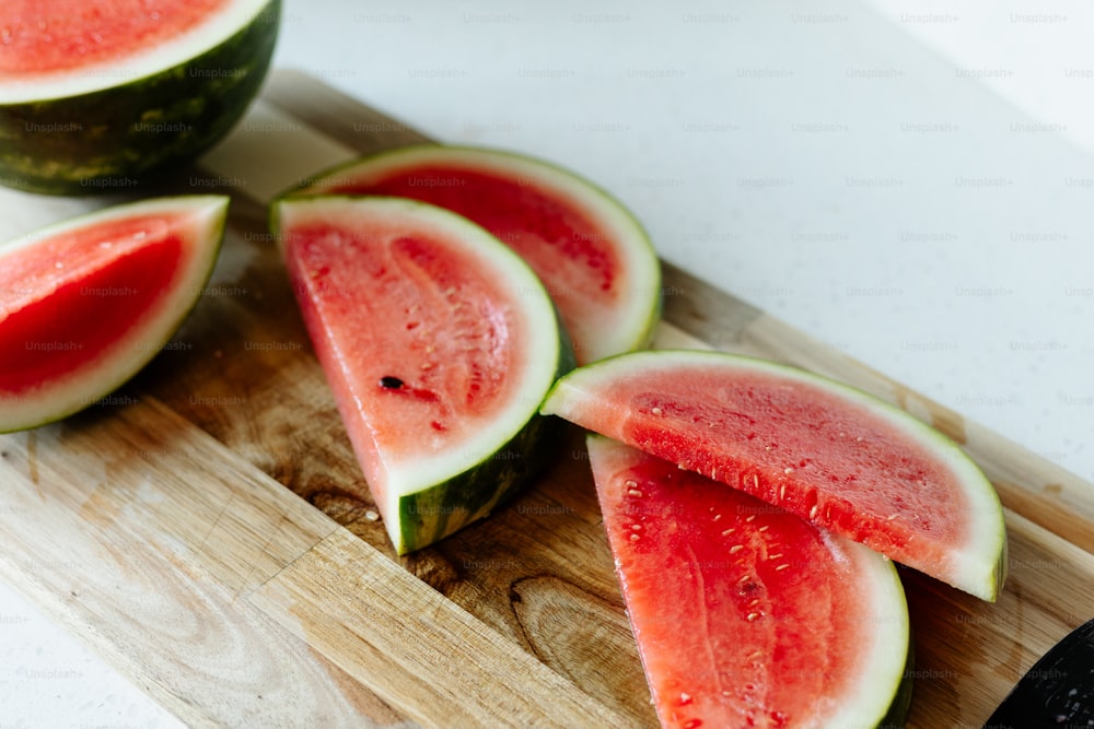 a cutting board with slices of watermelon on it