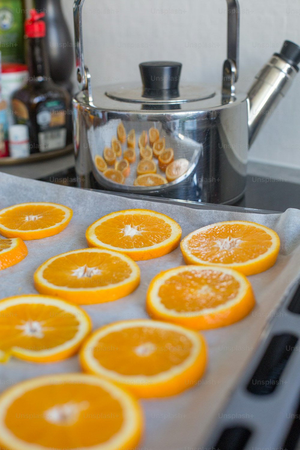 a tray of sliced oranges sitting on a counter