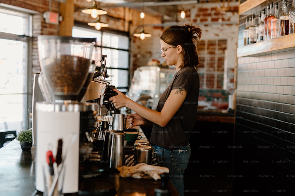 a woman standing at a counter in a coffee shop
