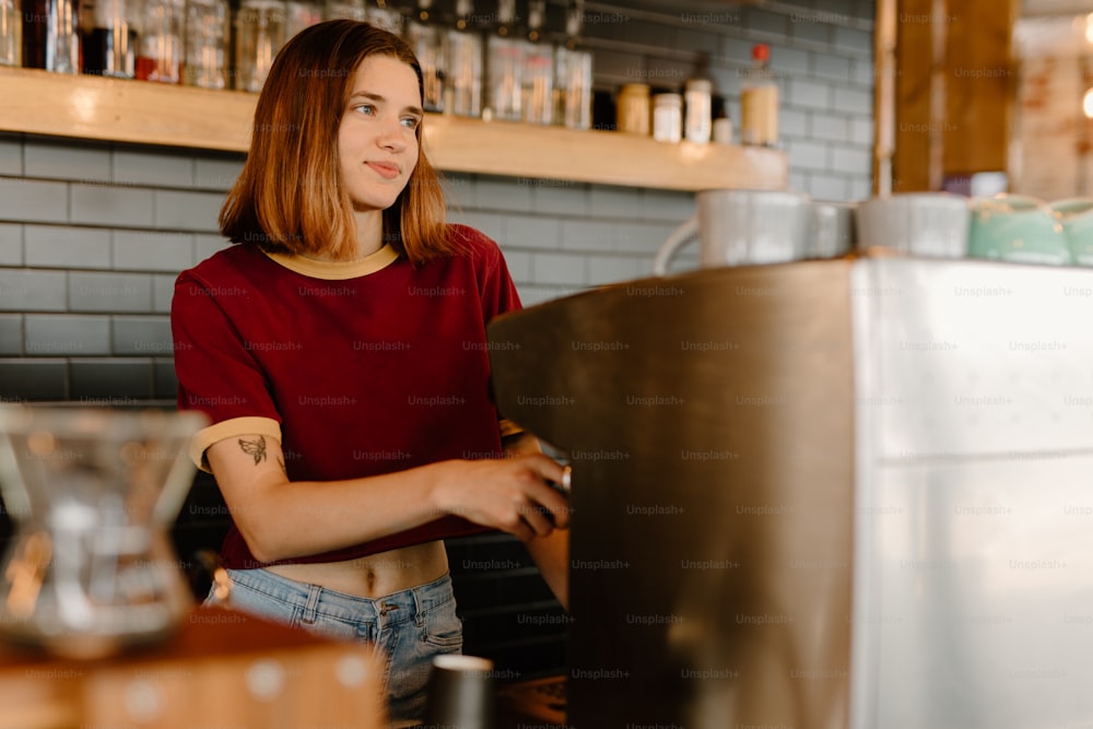 a woman standing at a counter in a restaurant
