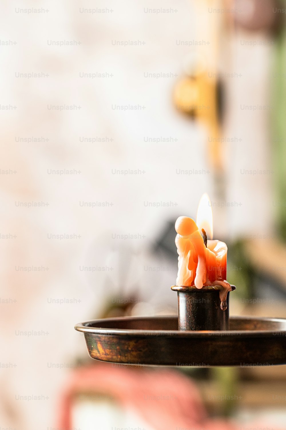 a candle that is sitting on a tray