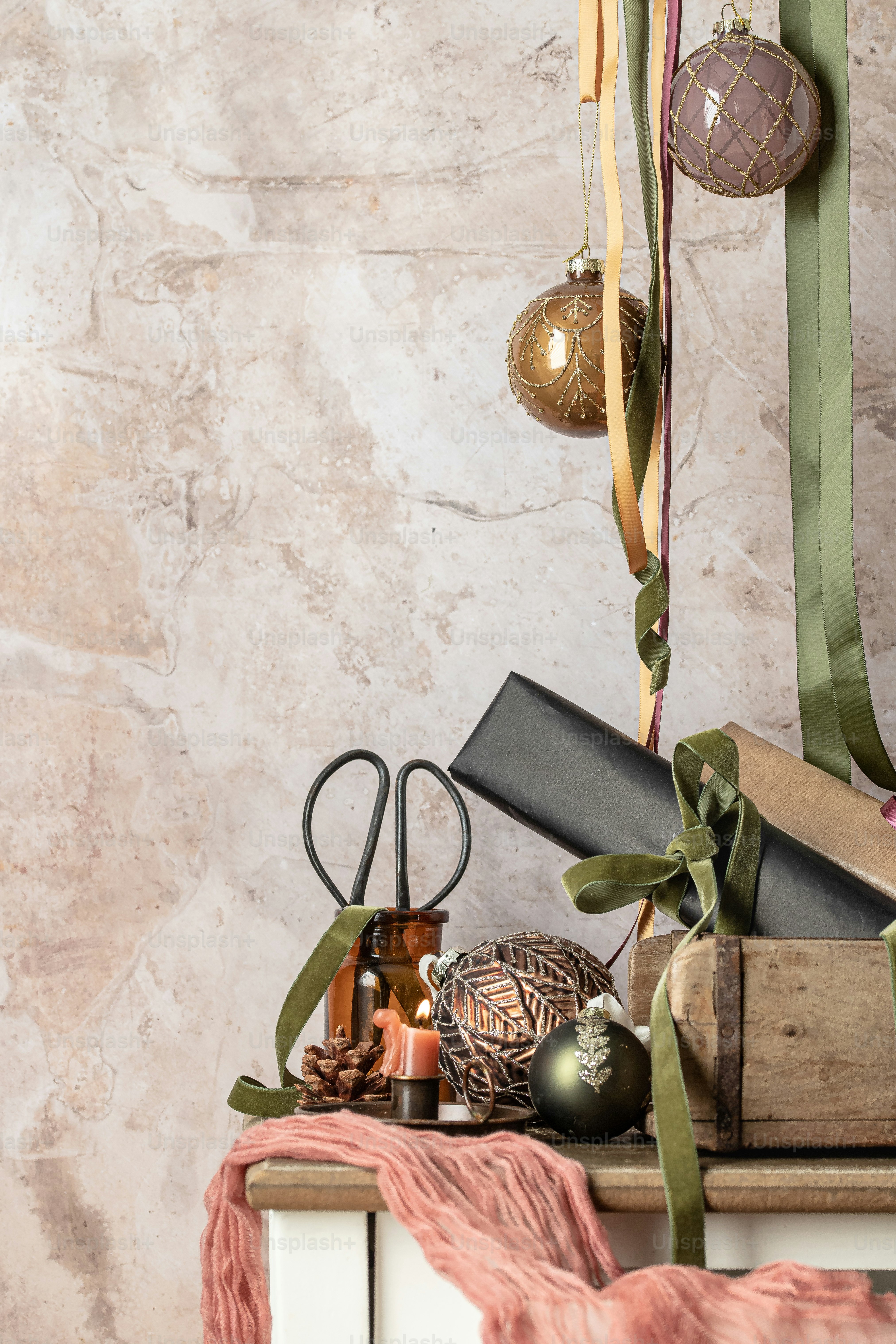 a table topped with a pile of books and ornaments