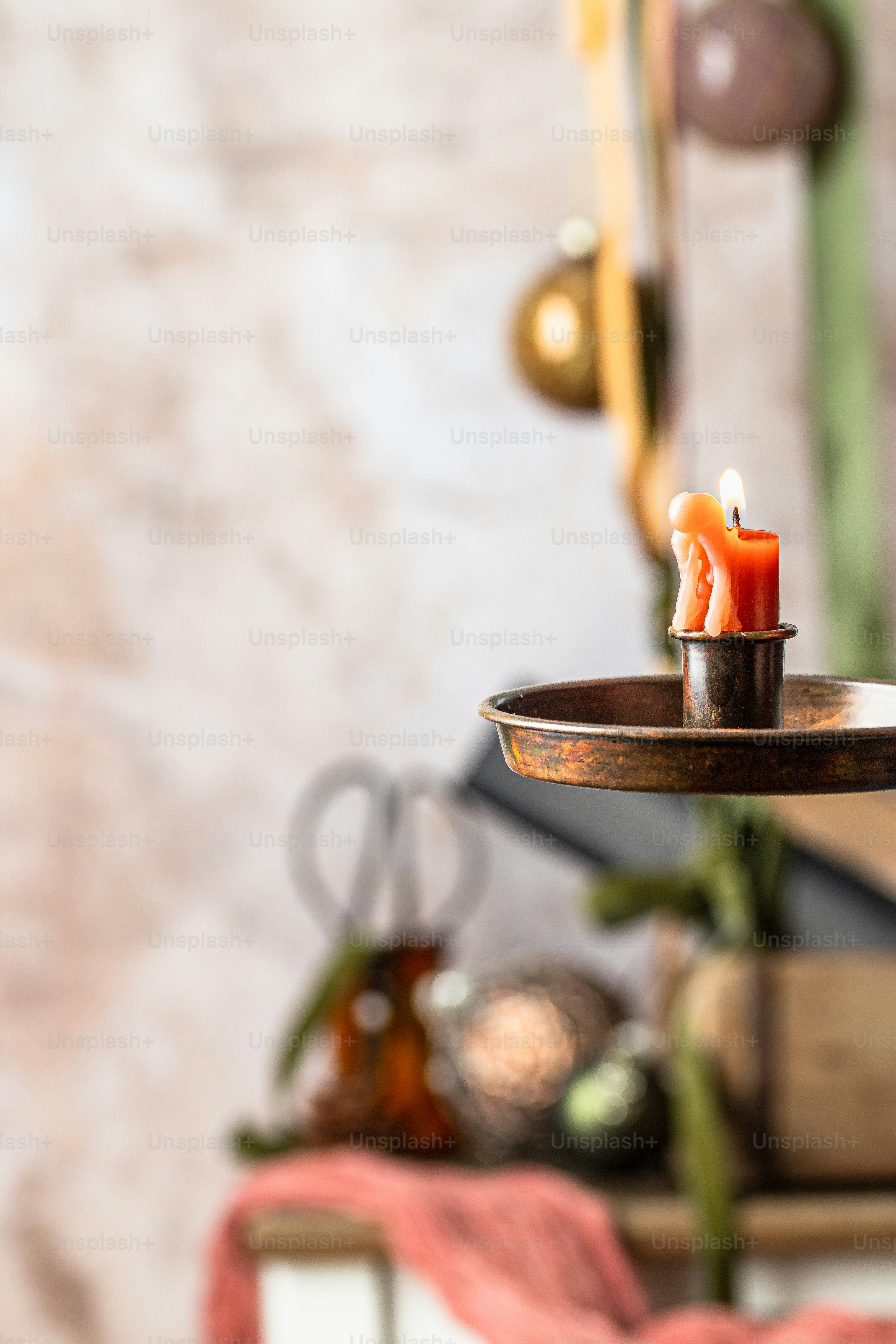 a tray with two candles on top of it