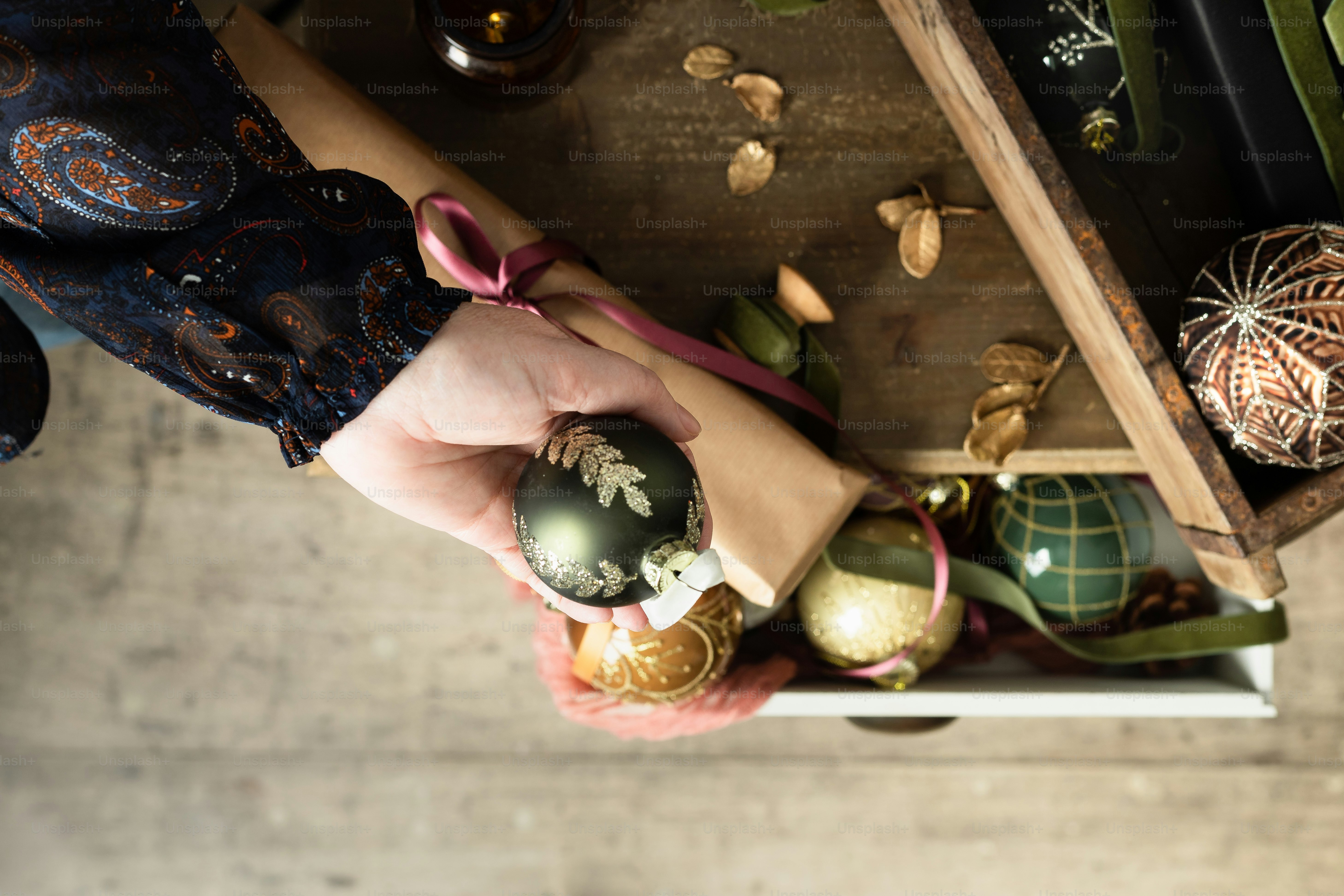 a person holding an ornament in their hand