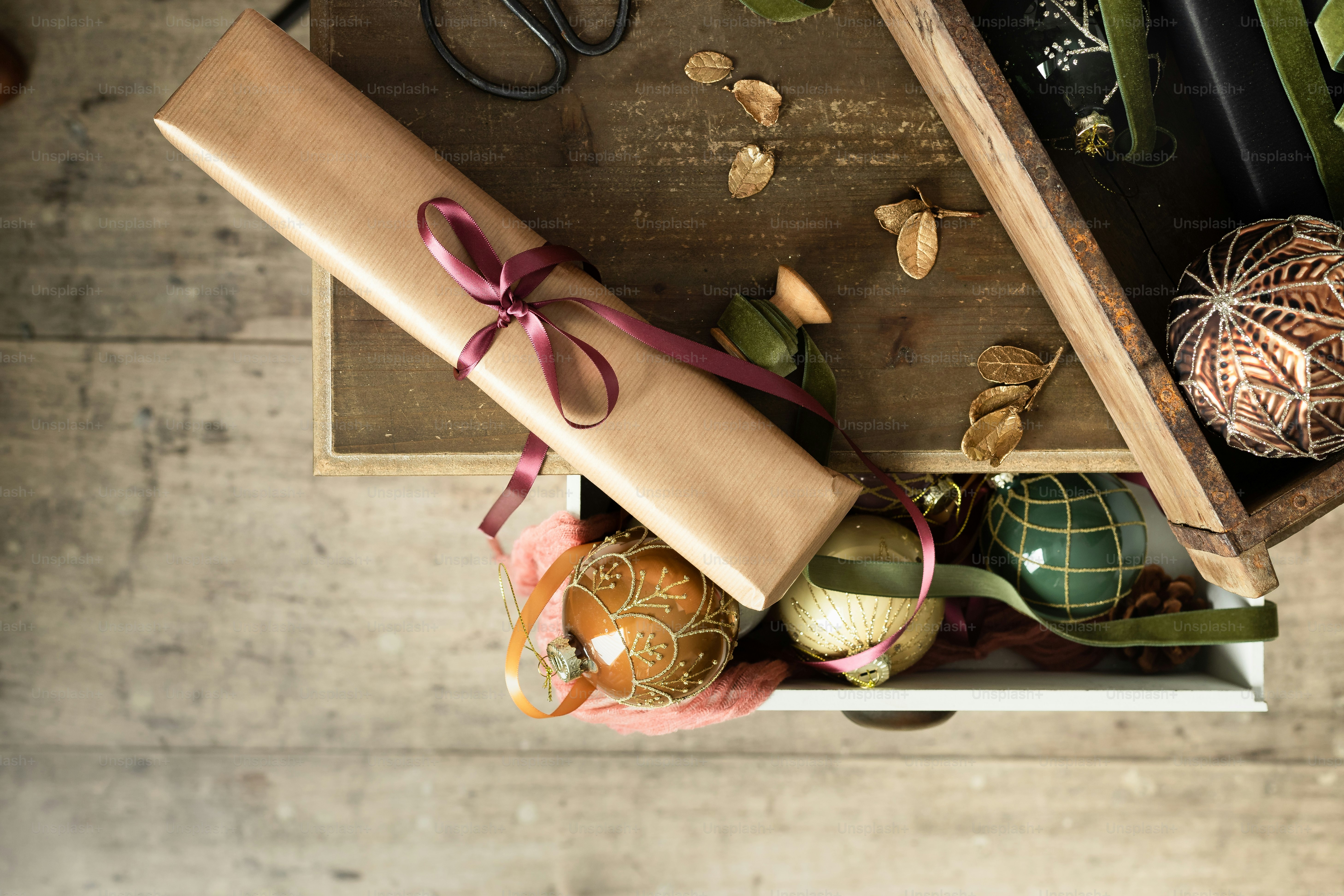 a wooden box with a wrapped present on top of it