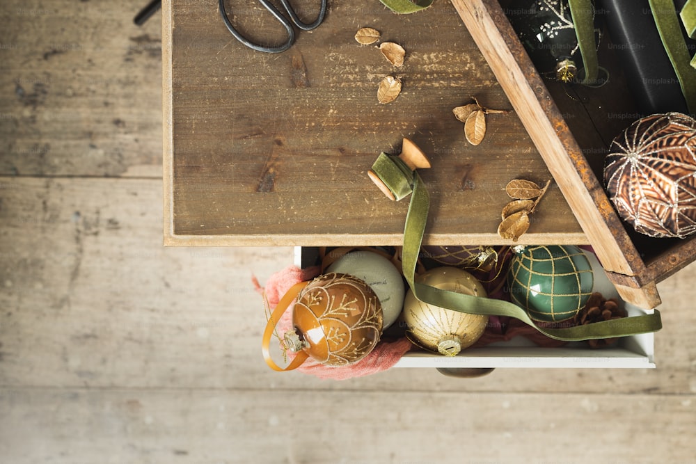 a wooden table topped with lots of different types of ornaments