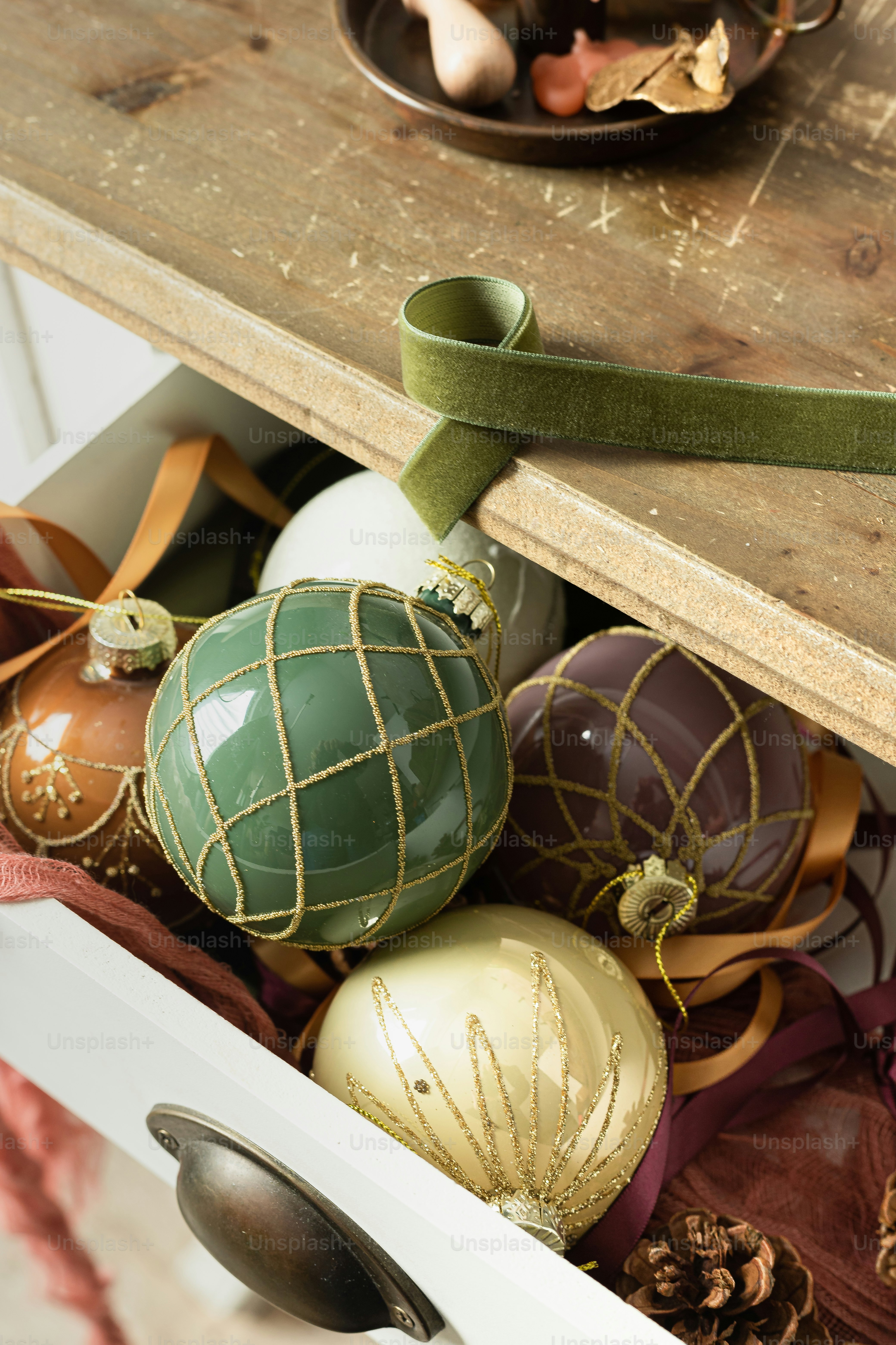 a wooden table topped with lots of ornaments