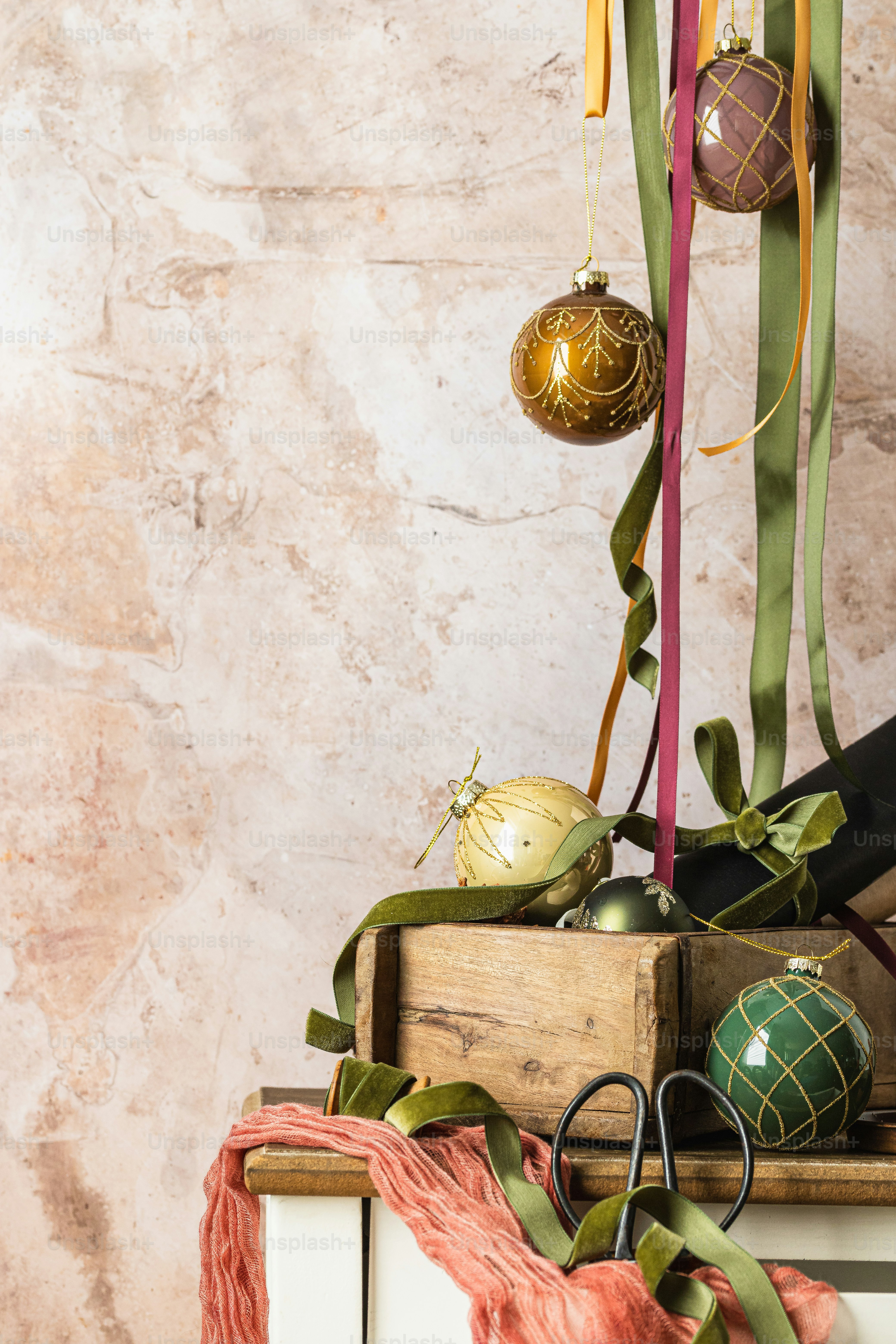a pair of scissors sitting on top of a wooden box