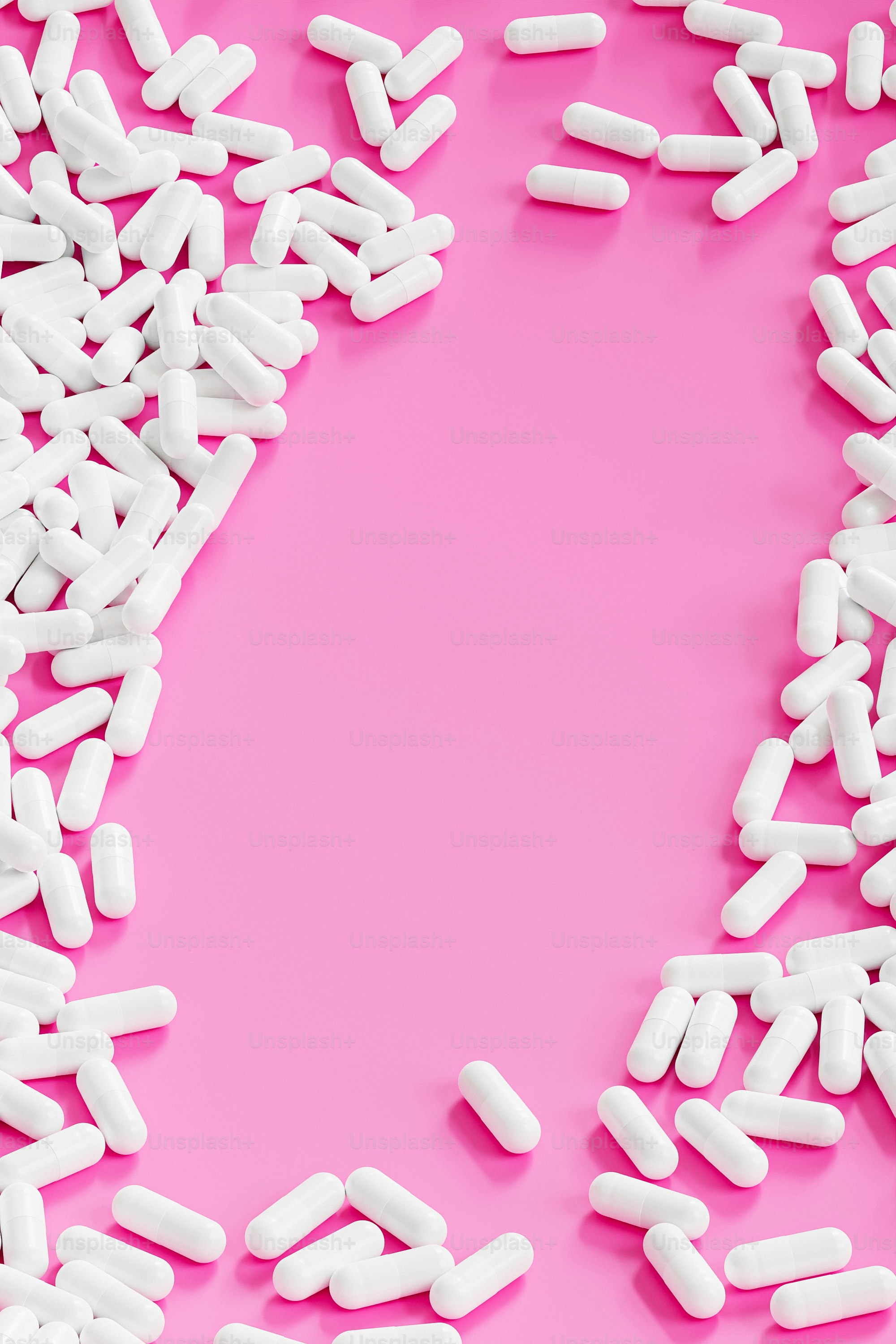a pink background with white pills on it