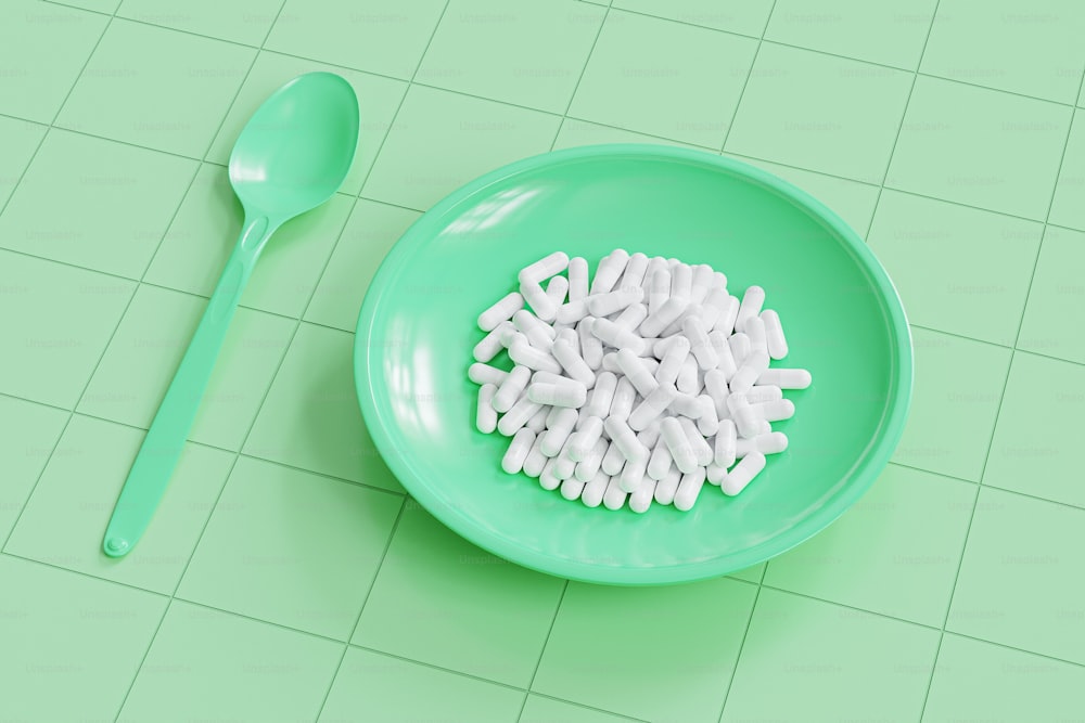 a bowl of pills and a spoon on a table