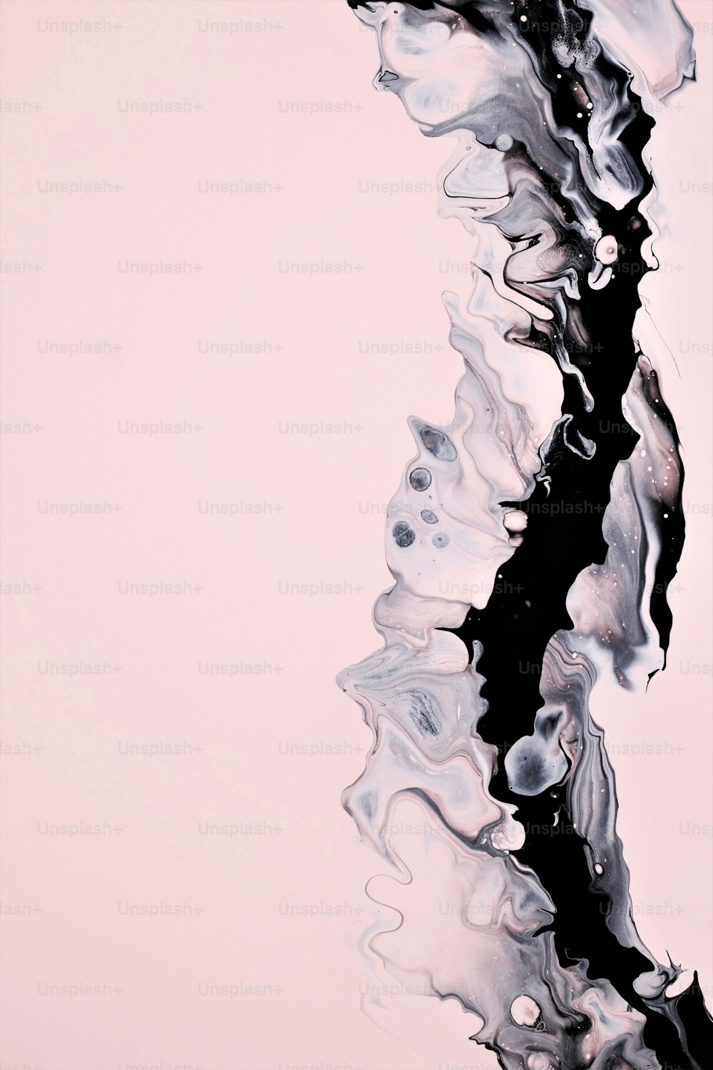 a black and white abstract painting on a pink background