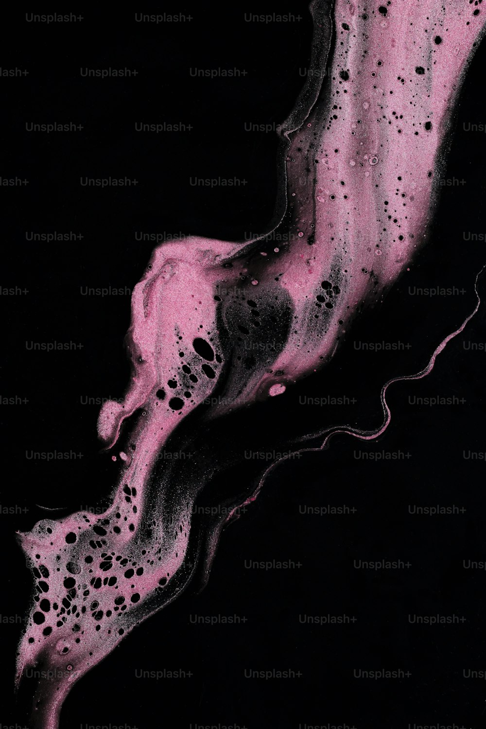 a black and pink painting on a black background