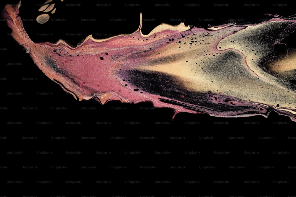 a close up of a liquid substance on a black background