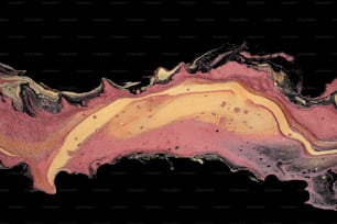 a black background with a pink and yellow swirl