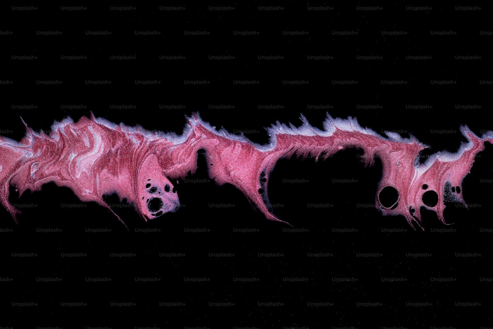 a black background with pink and white streaks