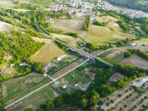 an aerial view of a rural area with a bridge