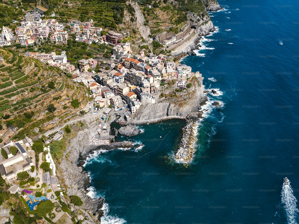 an aerial view of a village on the coast