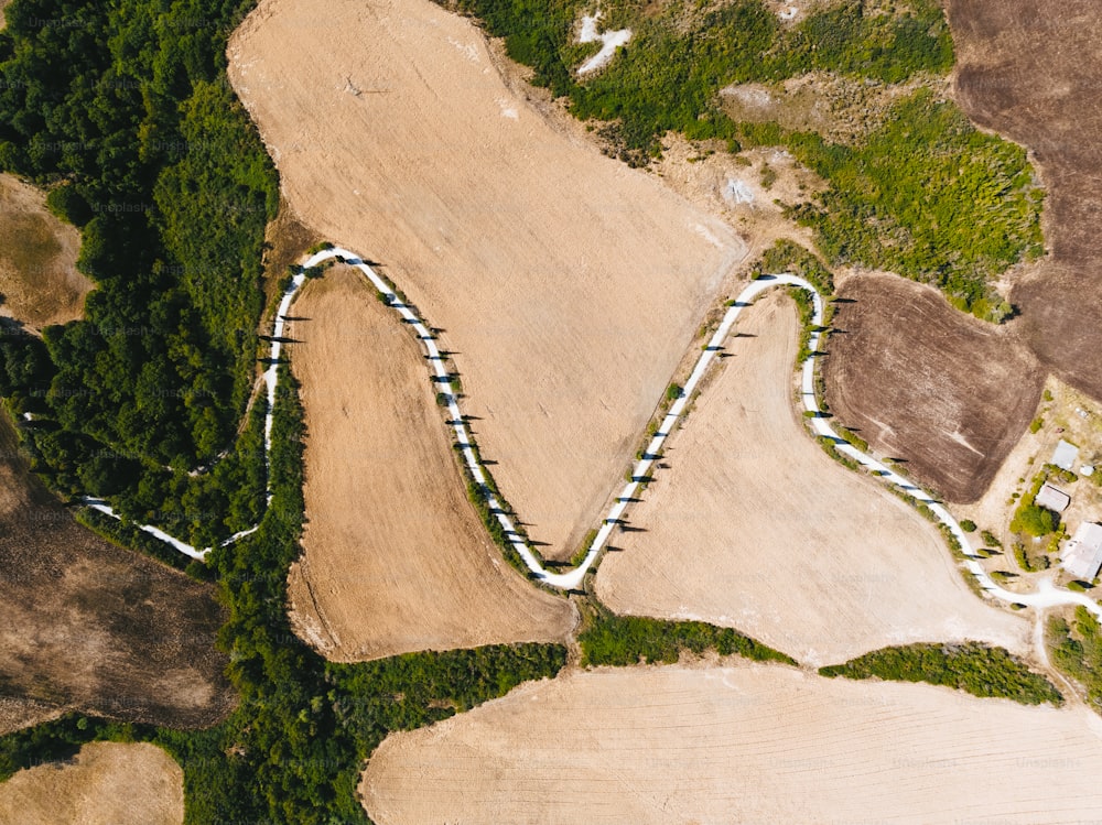 an aerial view of a track in the middle of a field