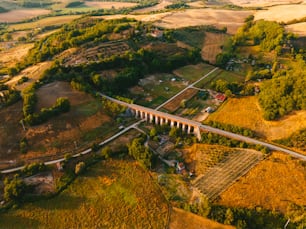 an aerial view of a bridge in the countryside