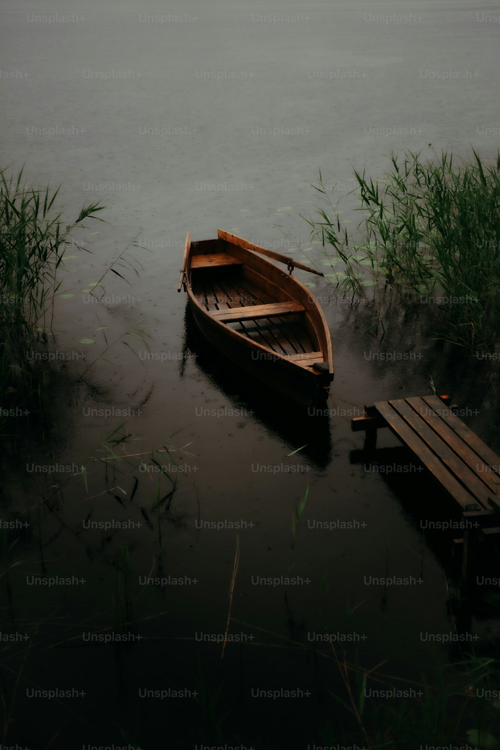 a small boat sitting on top of a body of water