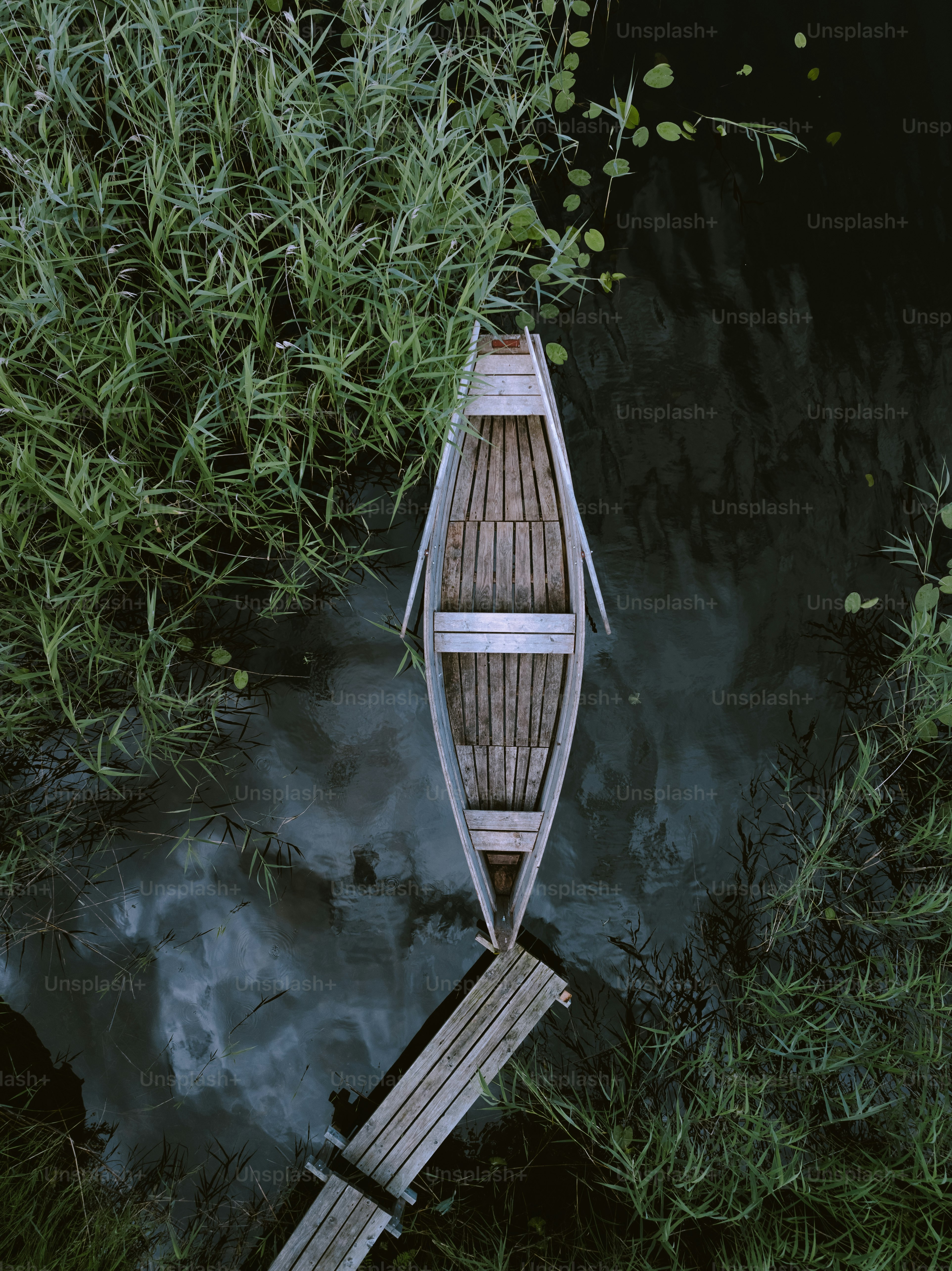 a small boat floating on top of a body of water