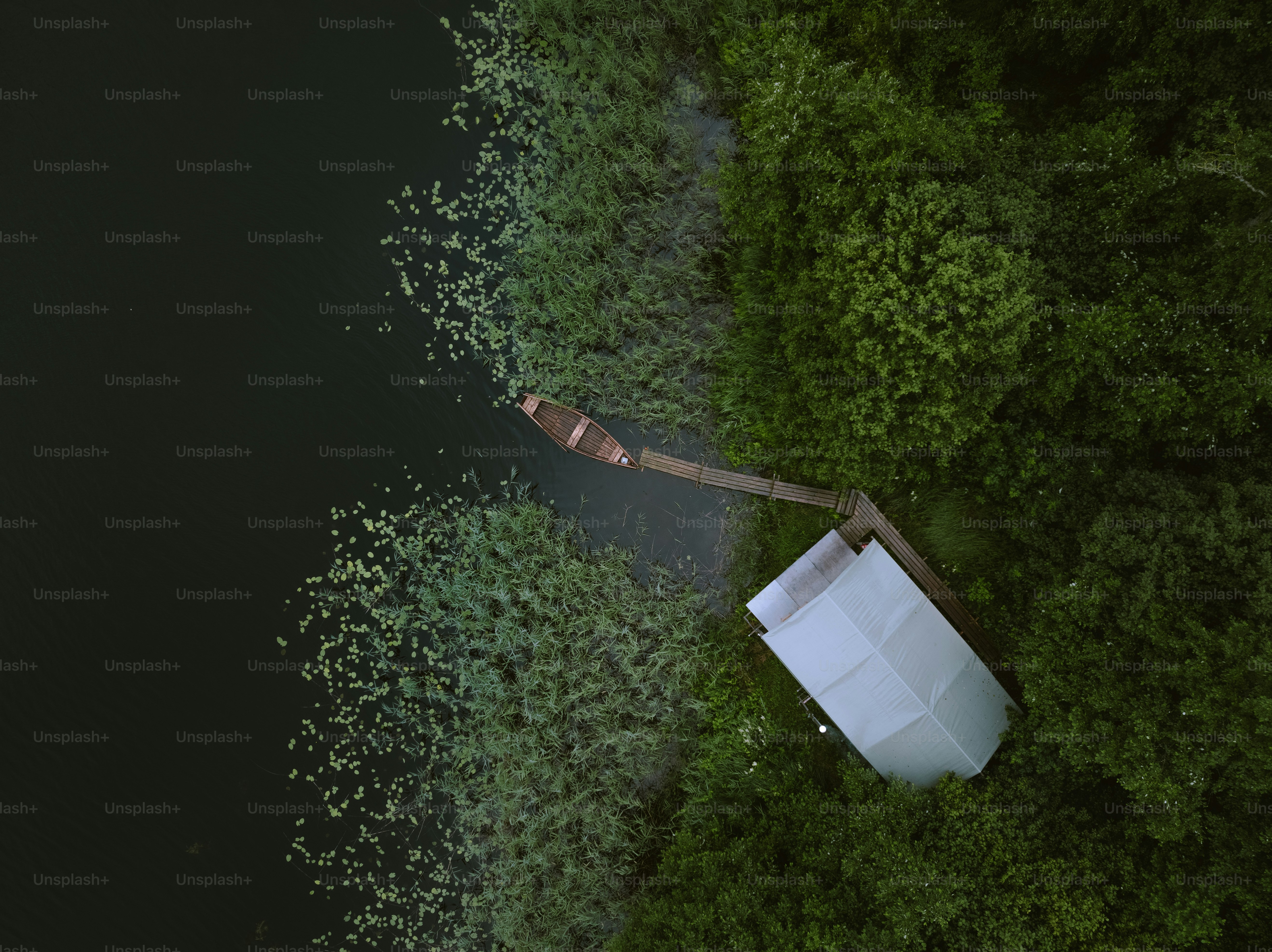 an aerial view of a boat in the water