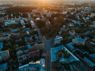 an aerial view of a city at sunset