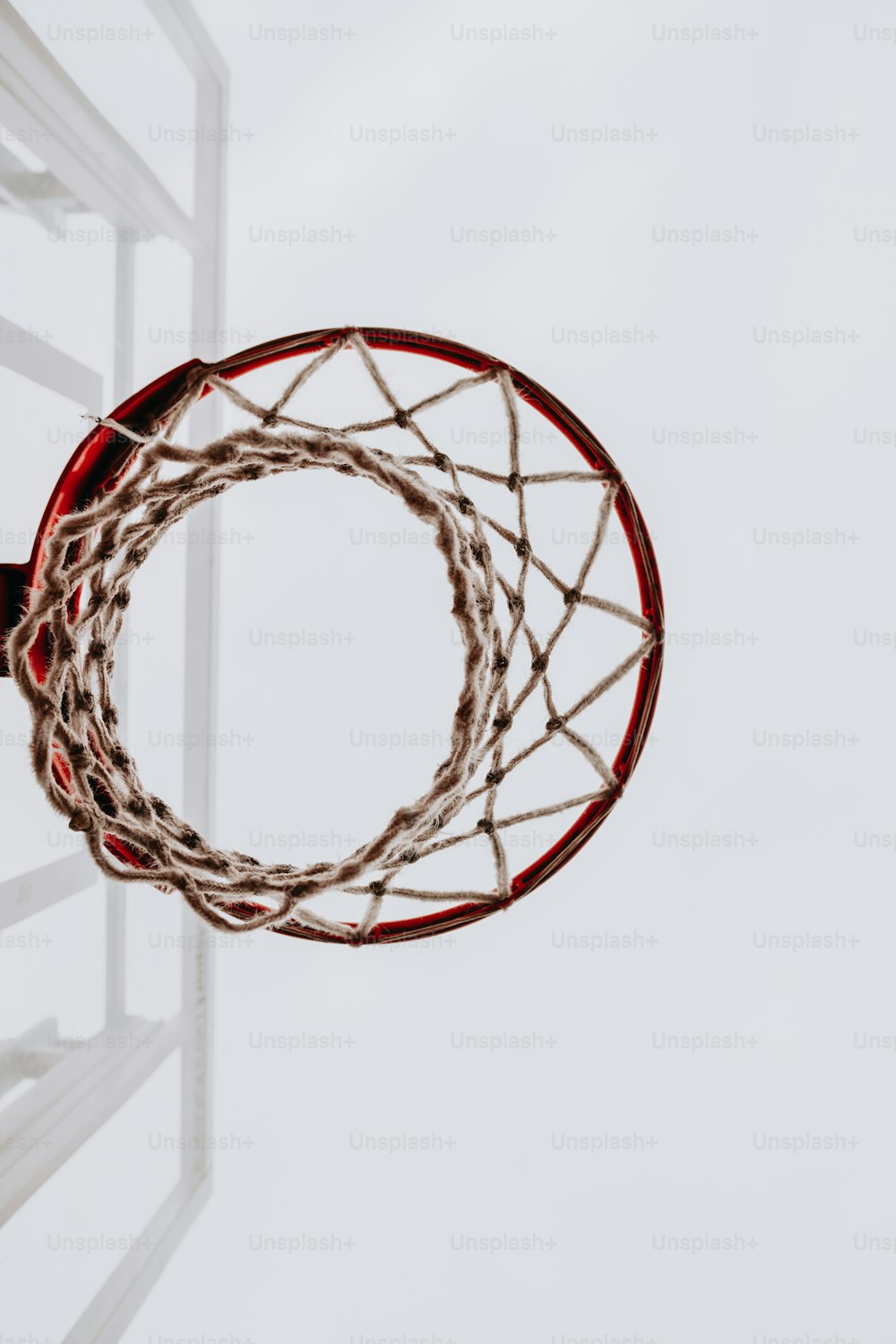 a basketball going through the rim of a basketball hoop