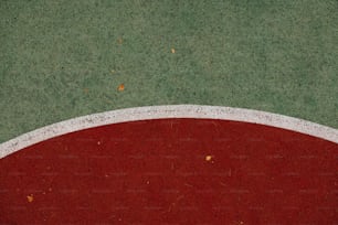 a close up of a baseball field with a red base