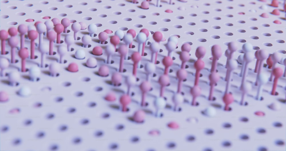 um grupo de pontos rosa e branco em uma superfície branca