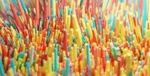 a close up of many different colored straws