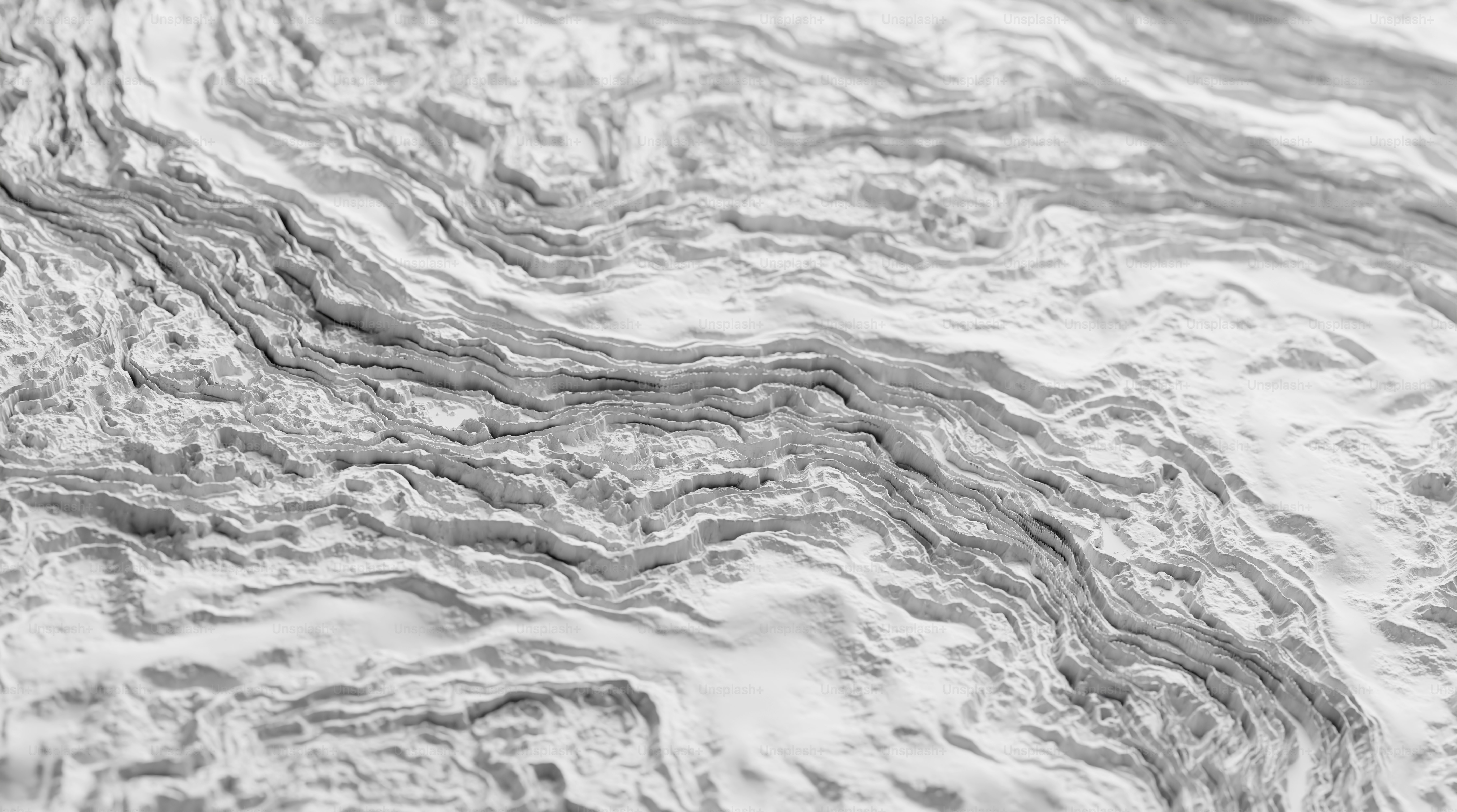 a black and white photo of a wavy surface