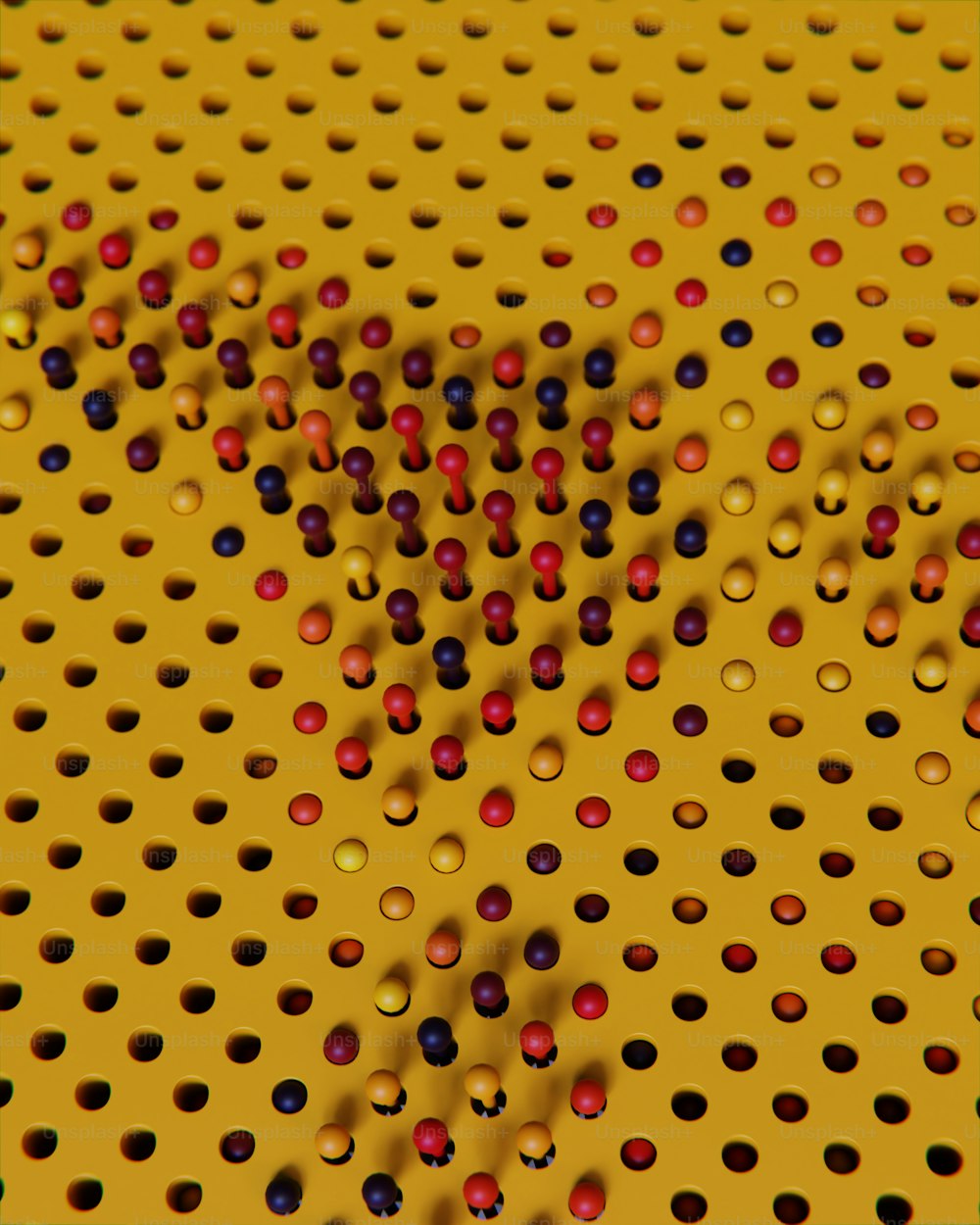 a yellow perfored surface with red and blue balls