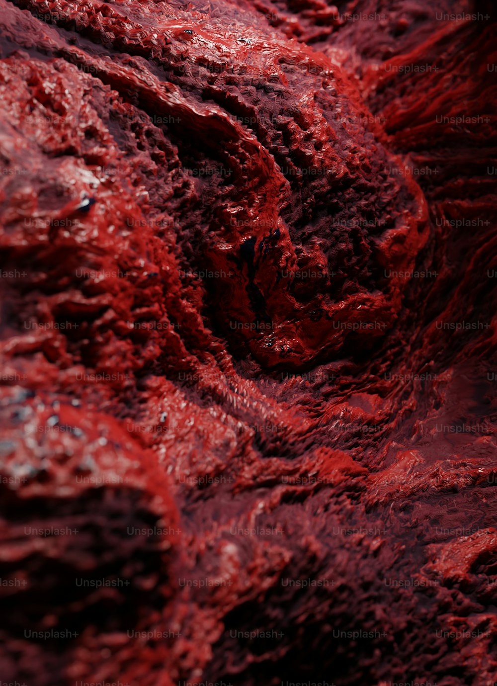 um close up de uma substância vermelha em uma superfície