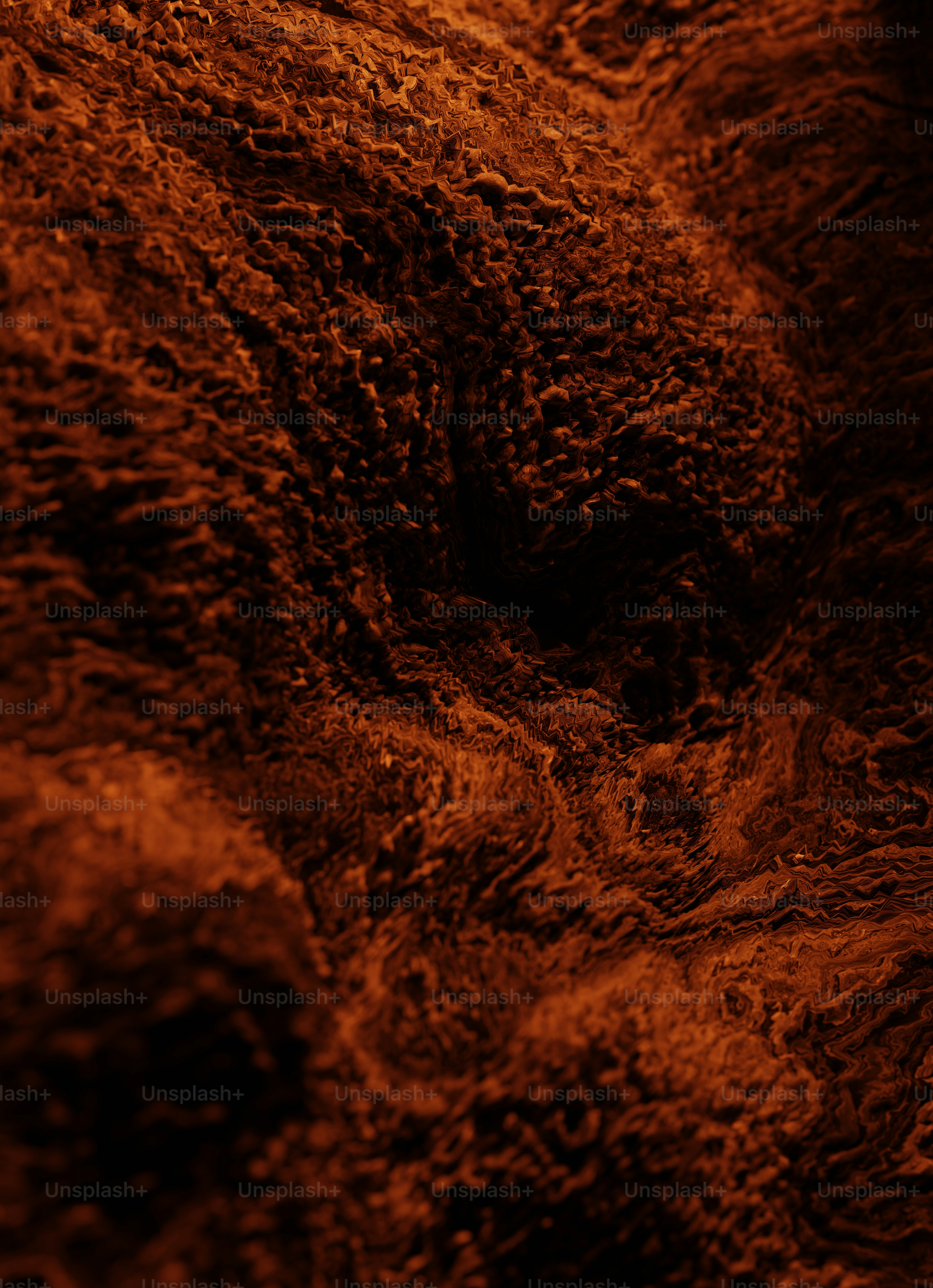 a close up of a brown substance on a black background