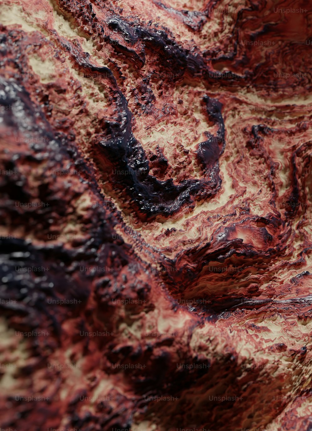 a close up of a red and black substance