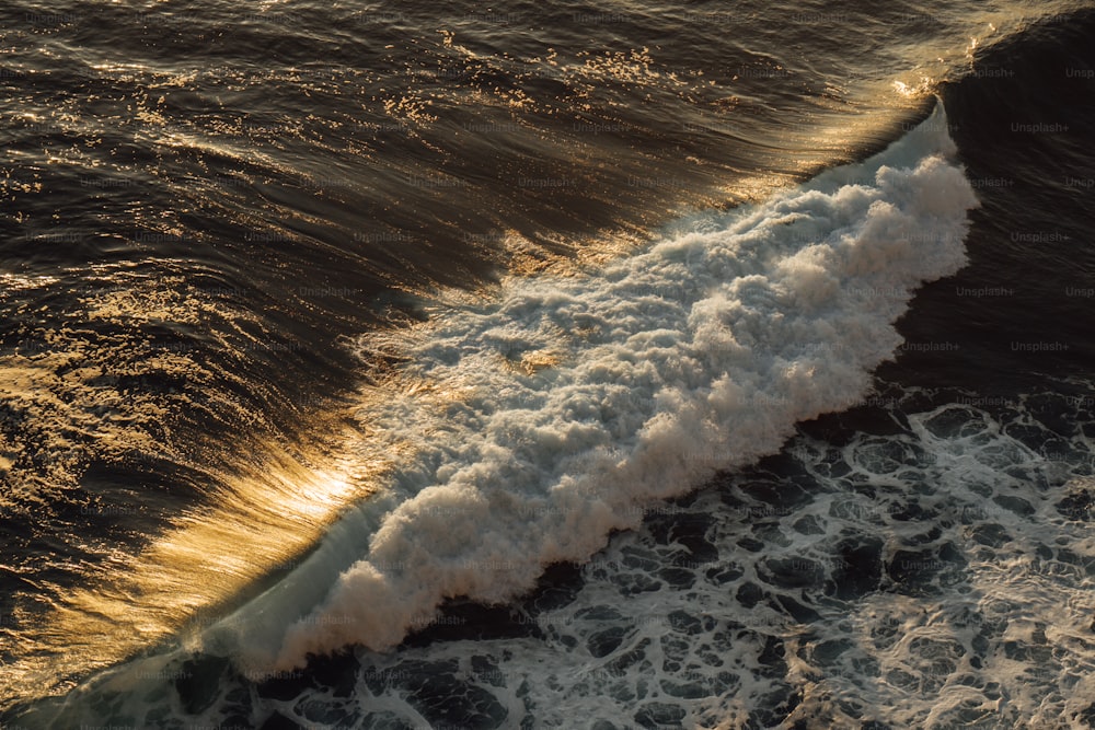 a wave is coming towards the shore of the ocean