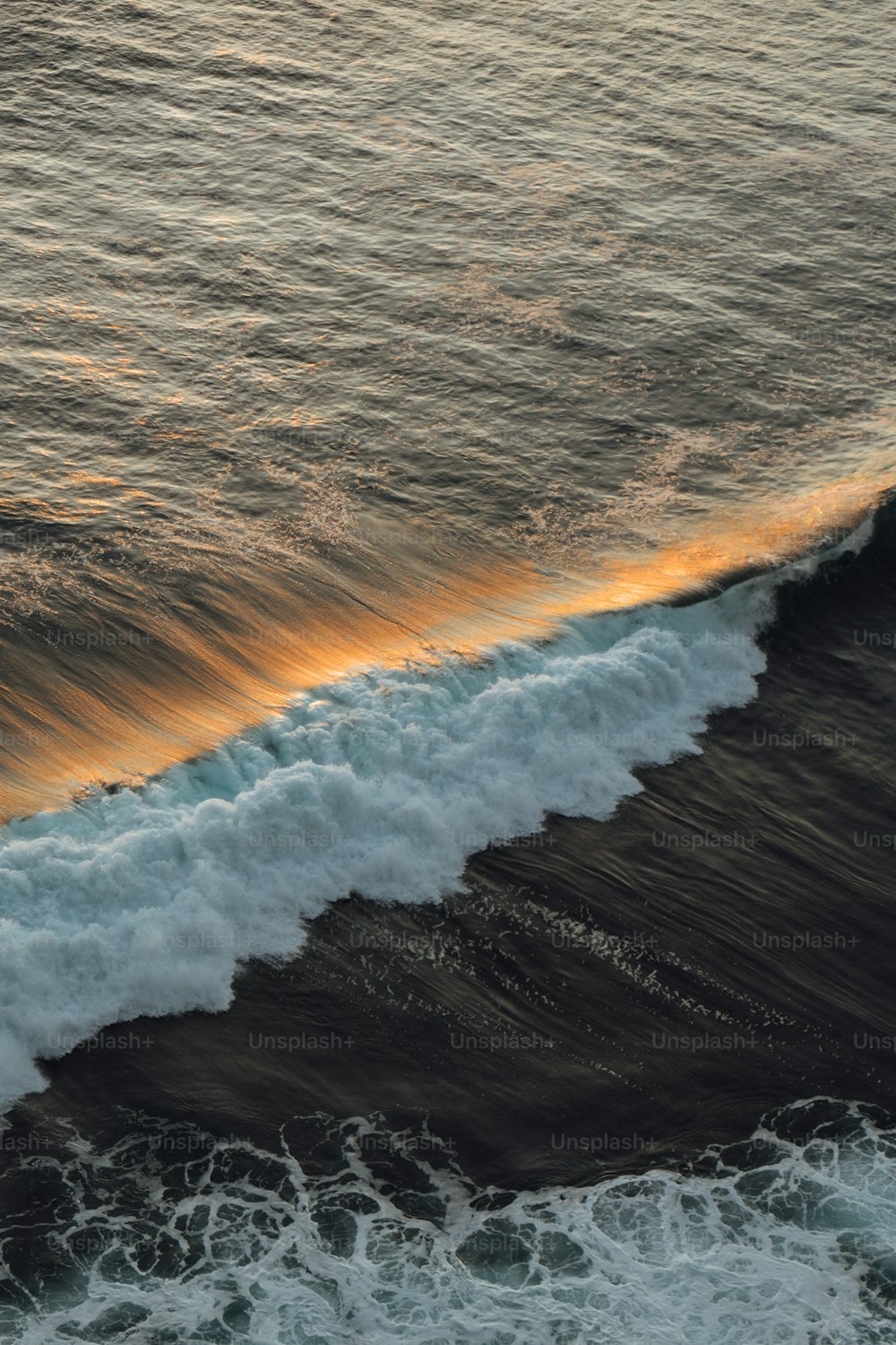 a person riding a surfboard on a wave in the ocean