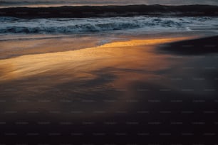 a beach with waves coming in to shore