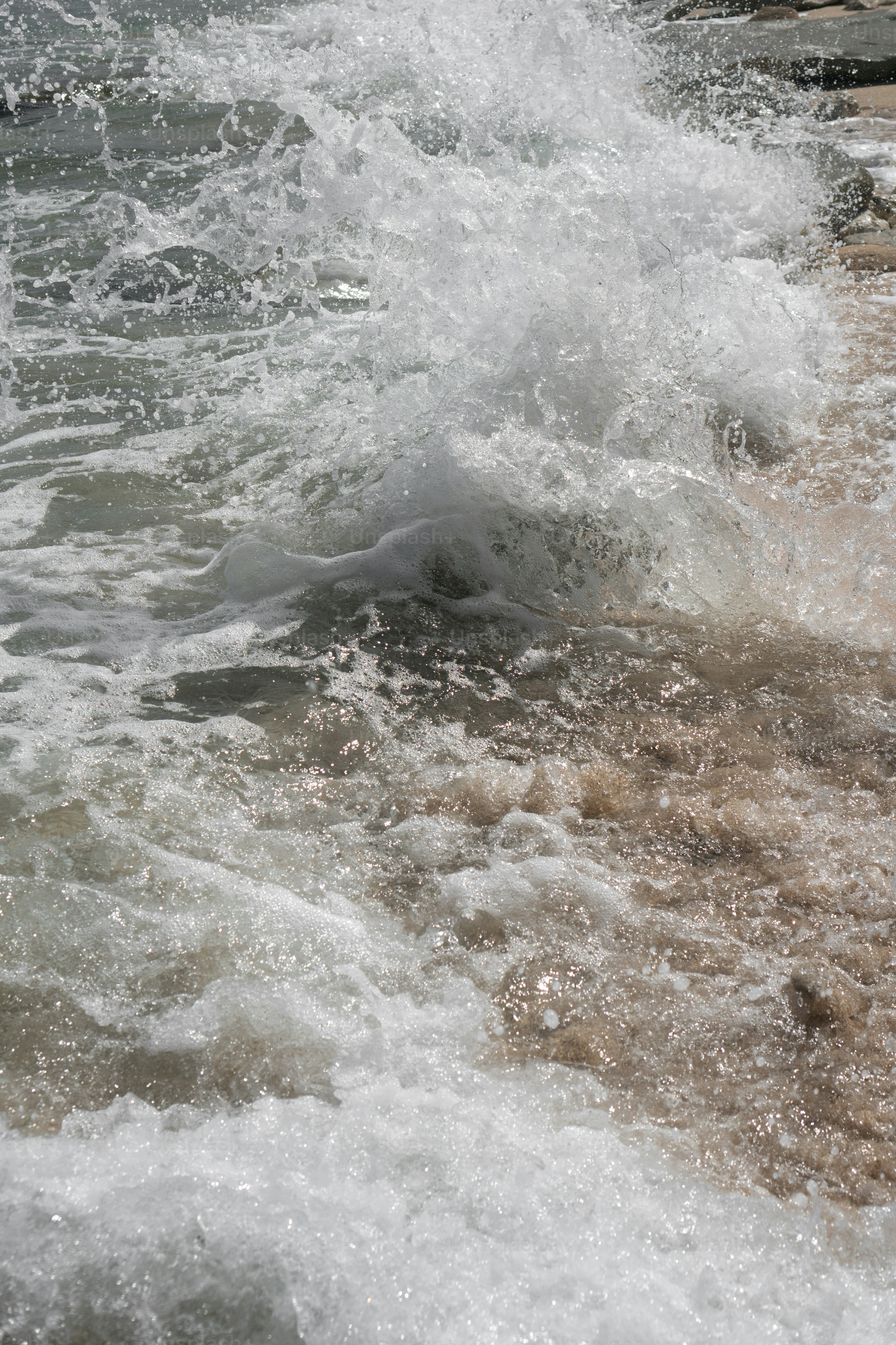 a person riding a surfboard on top of a body of water
