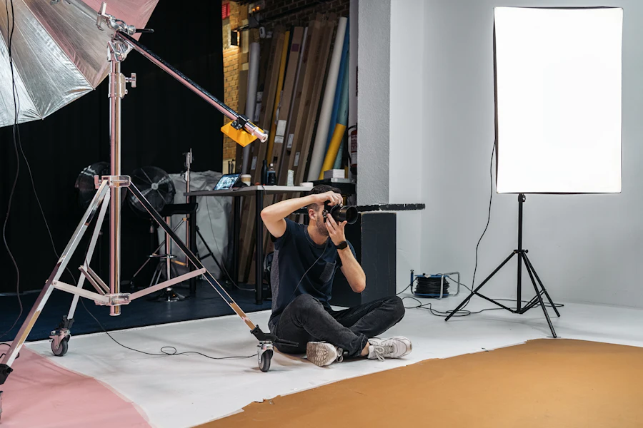 Photographer shooting from the floor of a lit studio