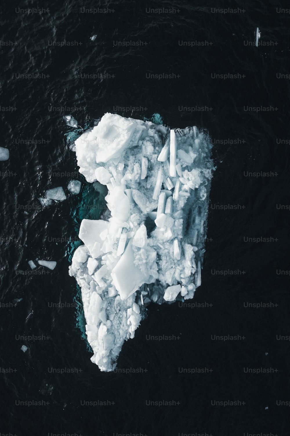 an iceberg floating on top of a body of water